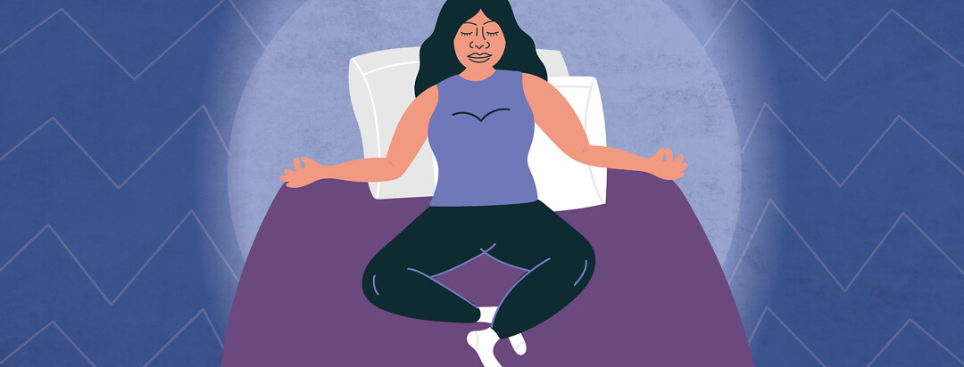 a woman meditating in her bed
