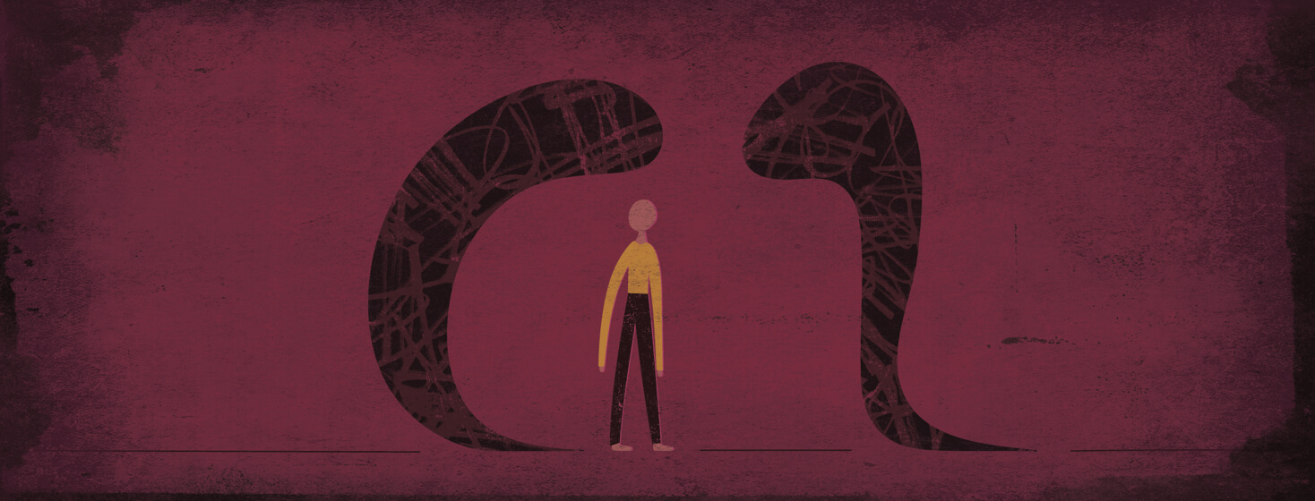 a person stands in a dark space with a shadow looming in front and behind them