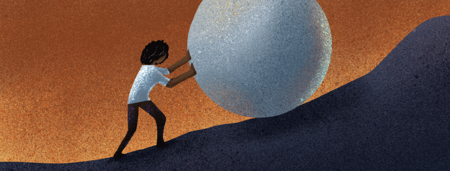 A person pushing a rock up a hill