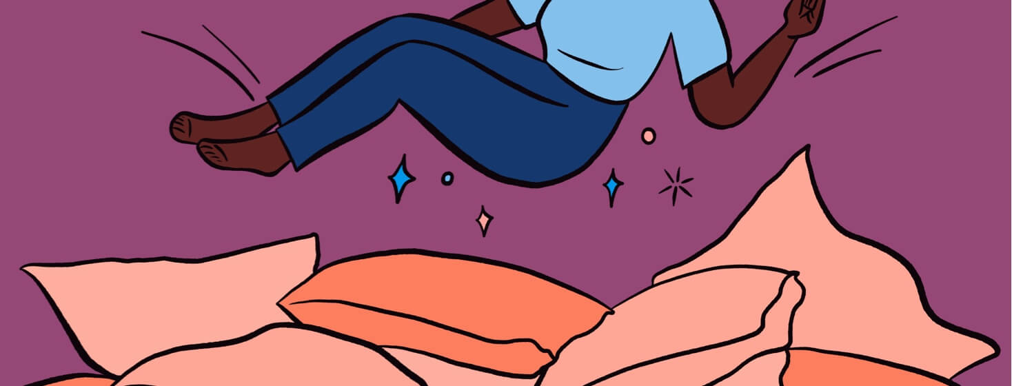 Body falling into a pile of pillows with sparkles underneath them