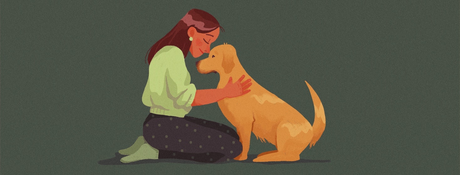 a woman hugging a dog
